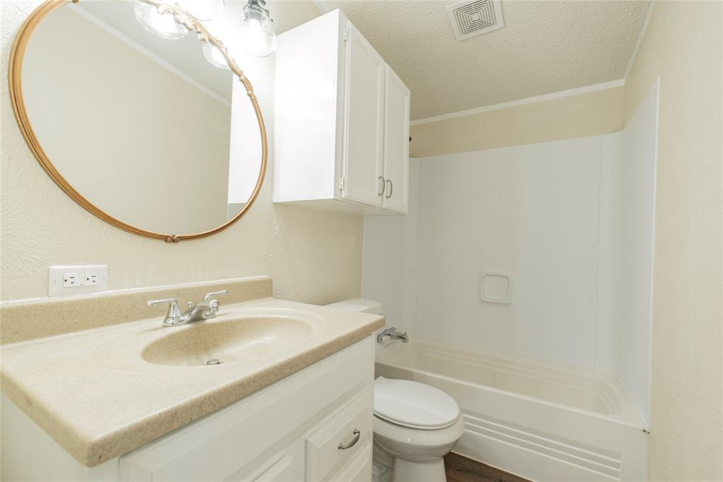 667 Rs County Road 1503 Point, TX 75472 - Photo 23 of 38 a bathroom with a sink toilet and a mirror