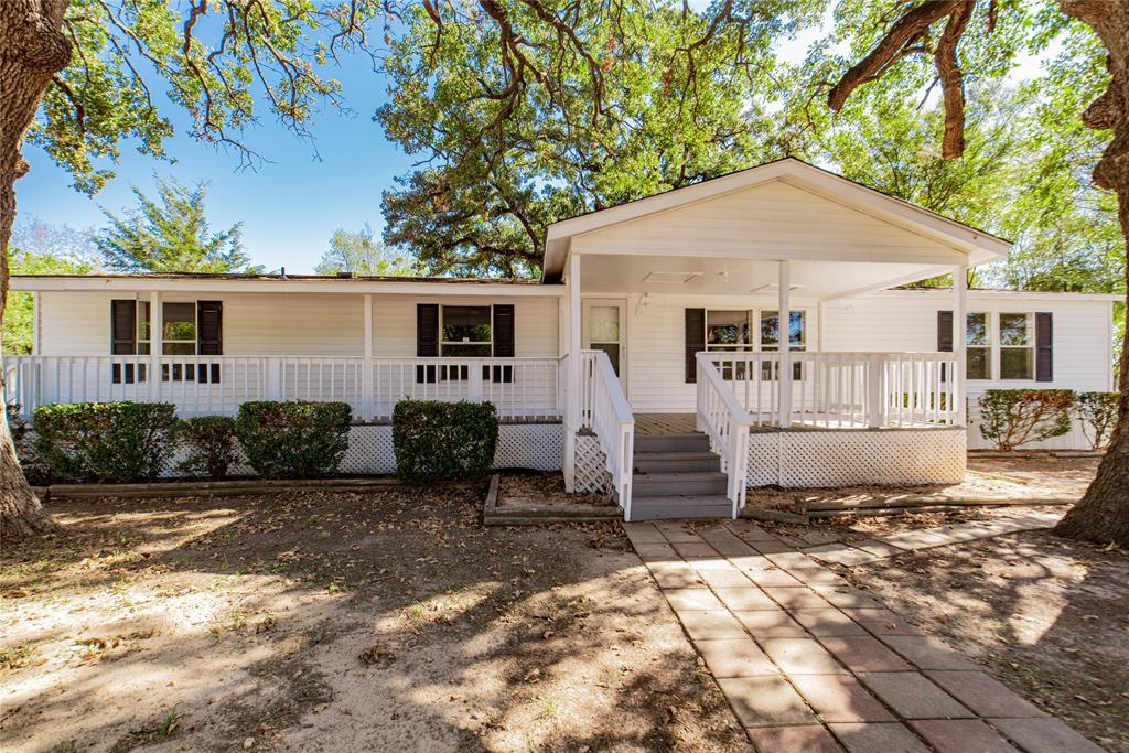 667 Rs County Road 1503 Point, TX 75472 - Photo 29 of 38 a front view of a house with a yard