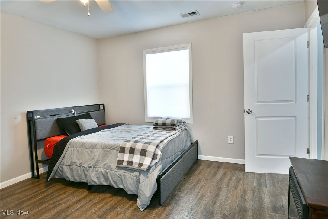 600 Prentice Road Northwest Warren, OH 44481 - Photo 44 of 47 Bedroom featuring wood-type flooring and ceiling fan