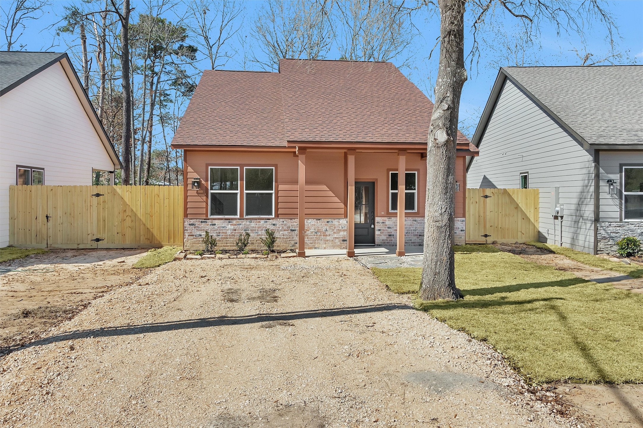 a view of a house with wooden fence