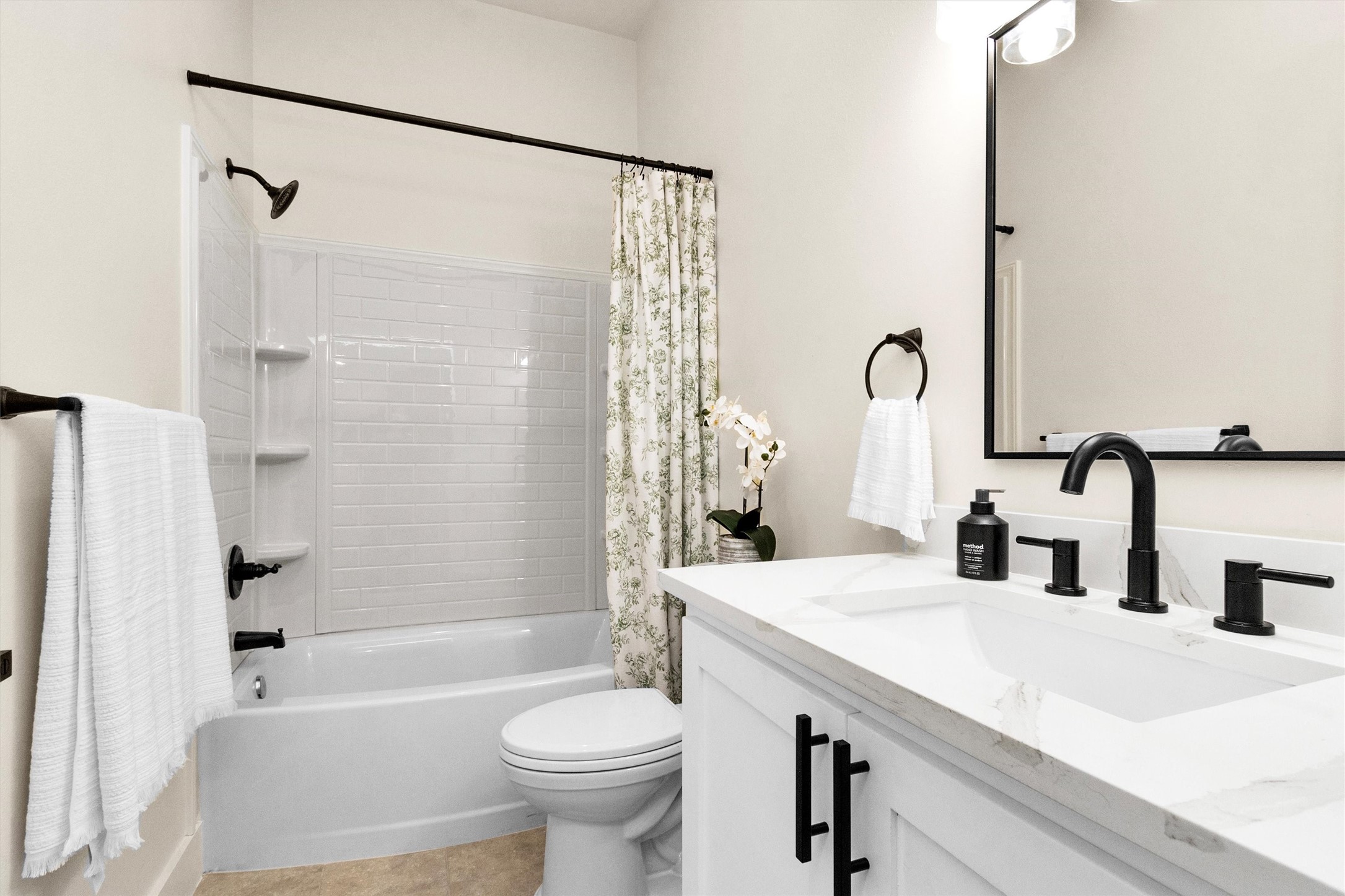 104 Canary St Point Point Blank, TX 77364 - Photo 16 of 28 a bathroom with a bathtub shower sink vanity mirror and toilet