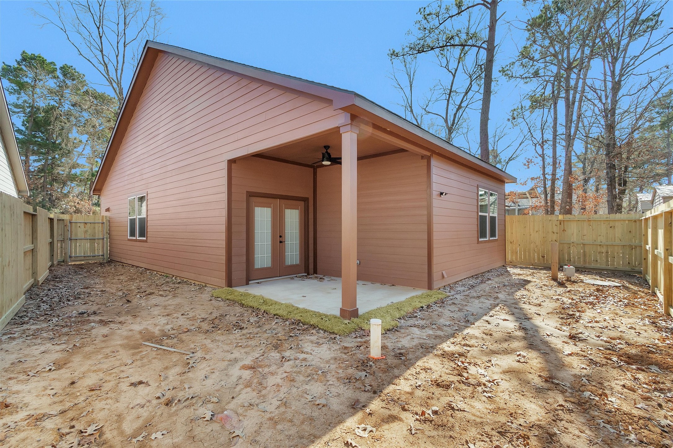 104 Canary St Point Point Blank, TX 77364 - Photo 26 of 28 a view of a house with a yard