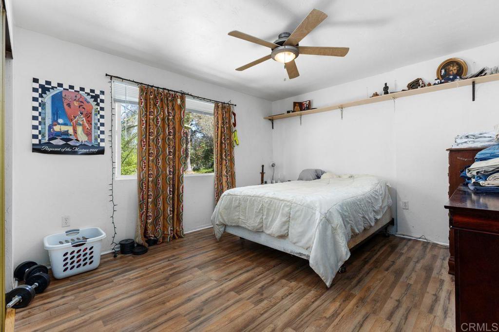 29560 Lilac Road Valley Center, CA 92082 - Photo 29 of 43 a bedroom with a bed and a window