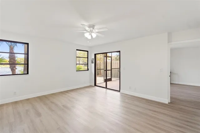 a spacious bathroom with a granite countertop sink mirror and toilet