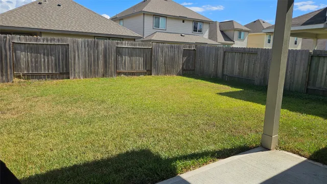a view of a backyard with pathway
