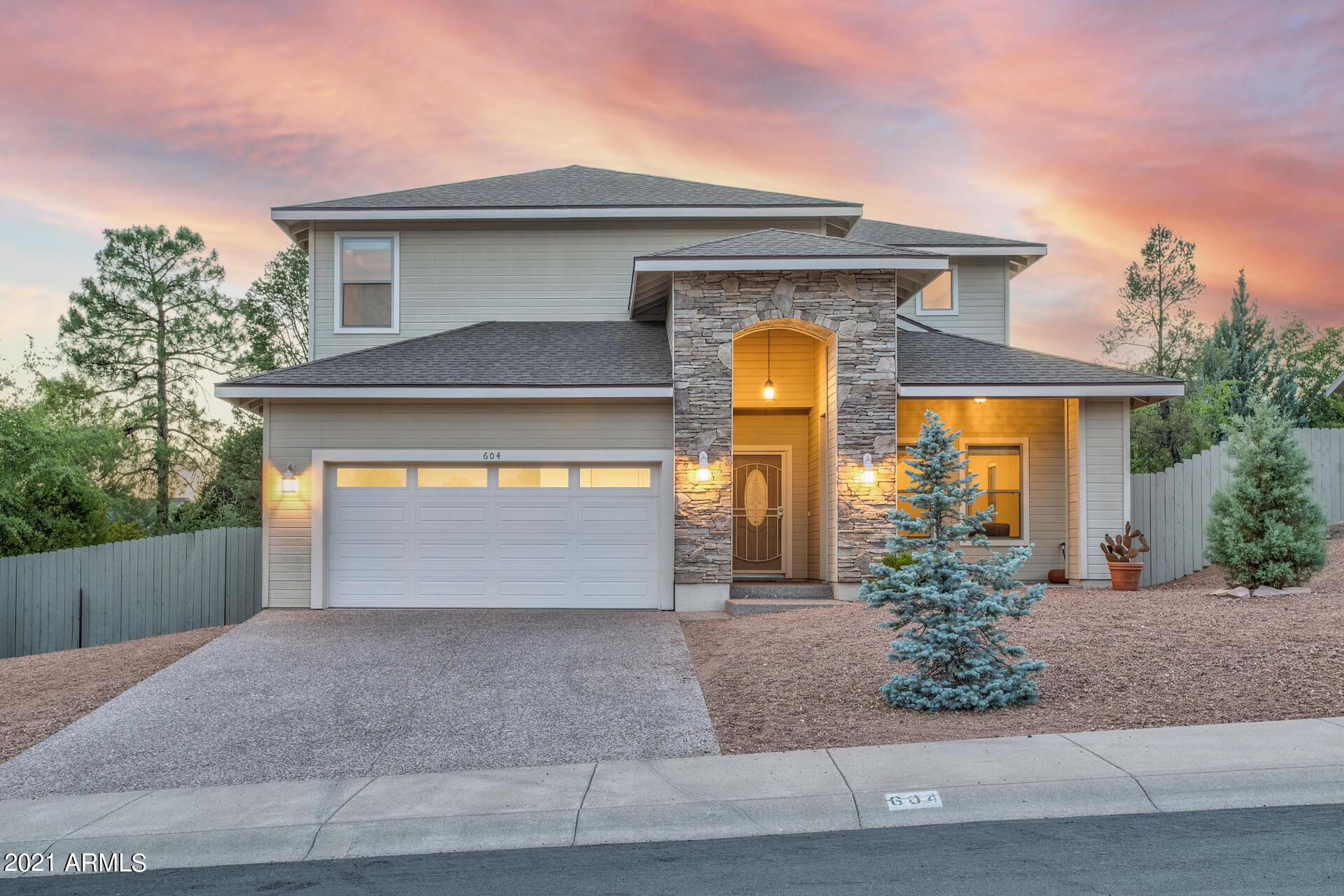 604 North Oak Ridge Road Payson, AZ 85541 - Photo 1 of 55 a front view of a house with a yard and garage