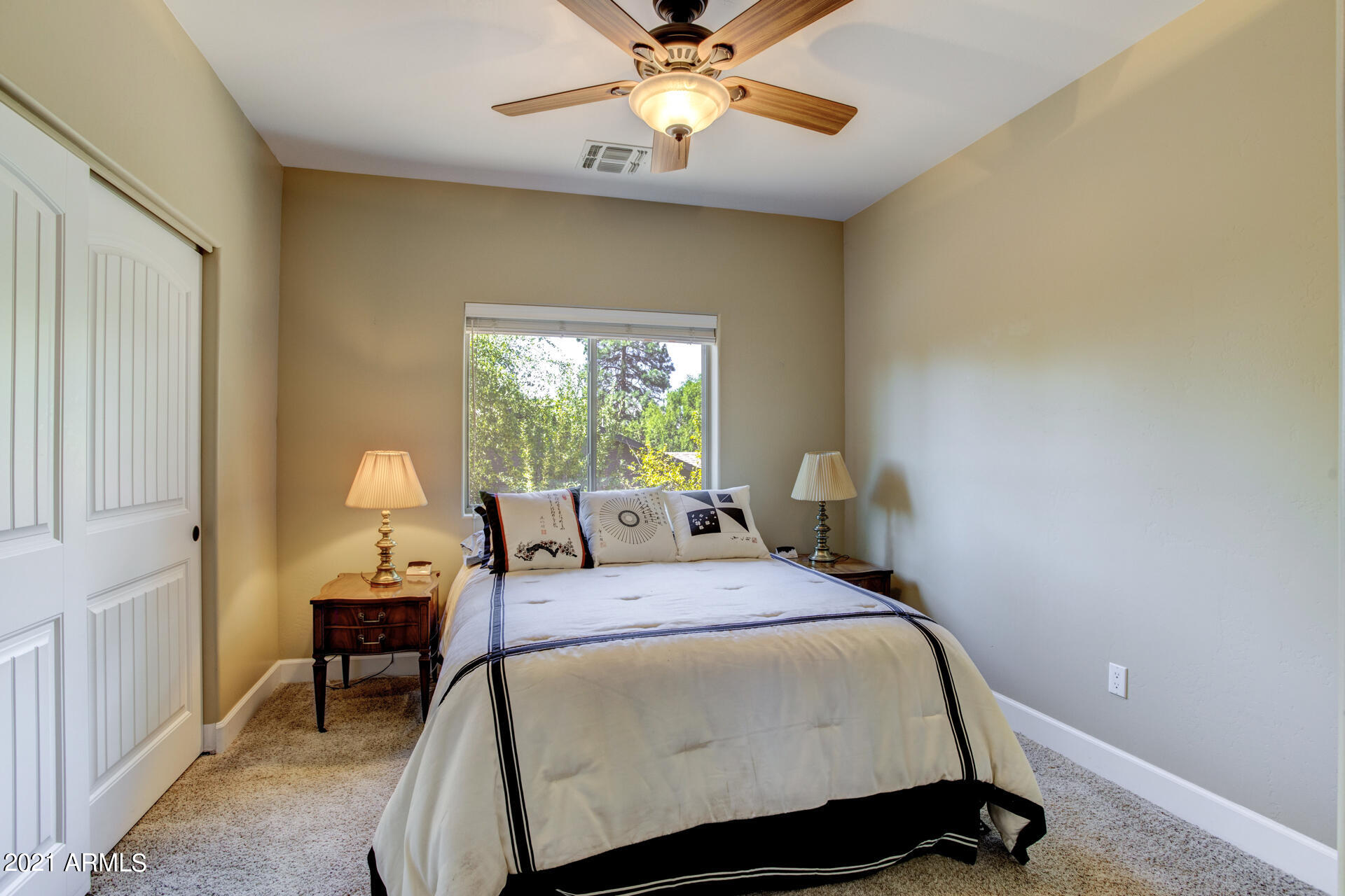 604 North Oak Ridge Road Payson, AZ 85541 - Photo 28 of 55 a bedroom with a bed and a chandelier