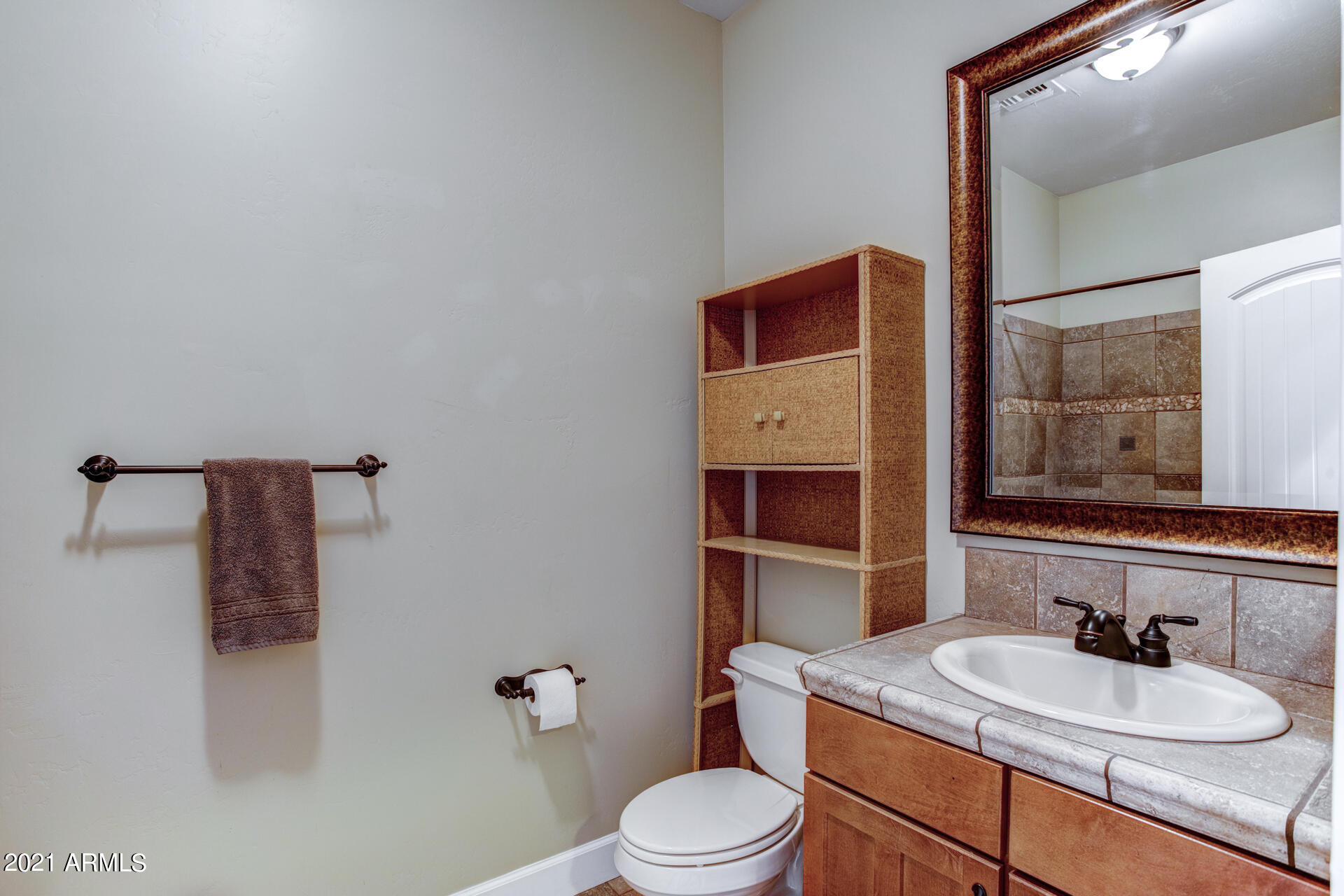 604 North Oak Ridge Road Payson, AZ 85541 - Photo 30 of 55 a bathroom with a sink toilet and a mirror