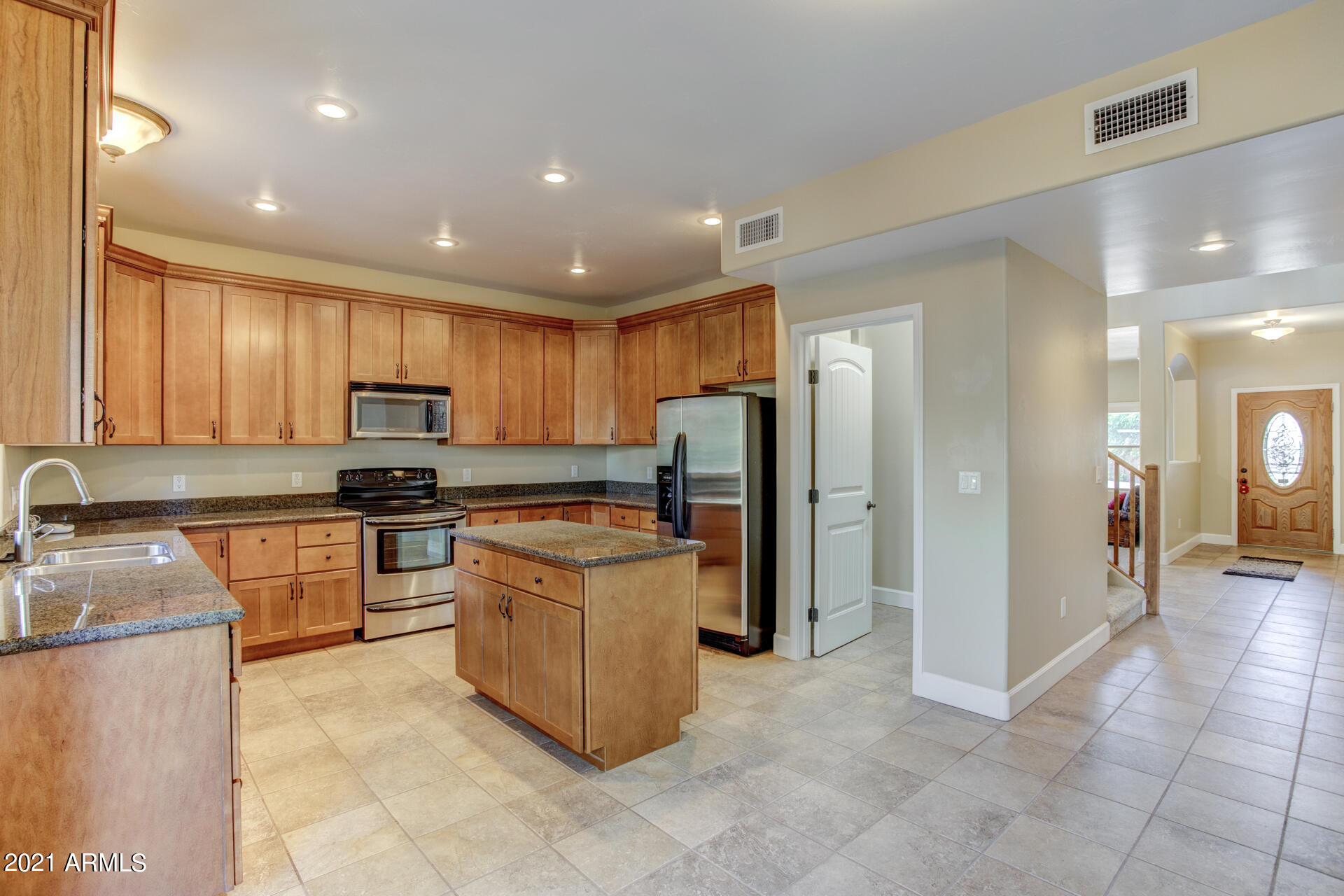 604 North Oak Ridge Road Payson, AZ 85541 - Photo 33 of 55 a kitchen with stainless steel appliances granite countertop a refrigerator stove top oven and sink