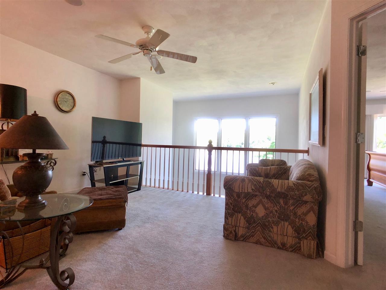 7524 North River Road Byron, IL 61010 - Photo 15 of 21 a living room with furniture and a flat screen tv