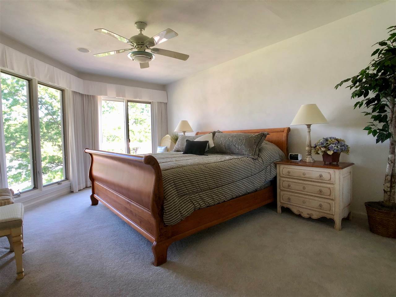 7524 North River Road Byron, IL 61010 - Photo 17 of 21 a bedroom with a bed dresser and a window