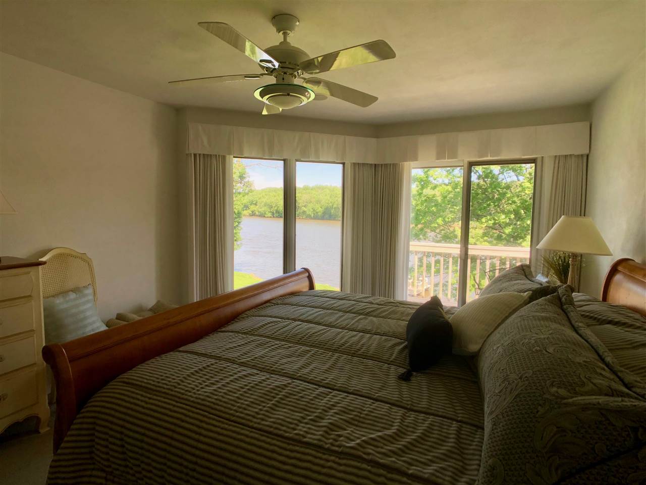 7524 North River Road Byron, IL 61010 - Photo 18 of 21 a bedroom with a bed and a window