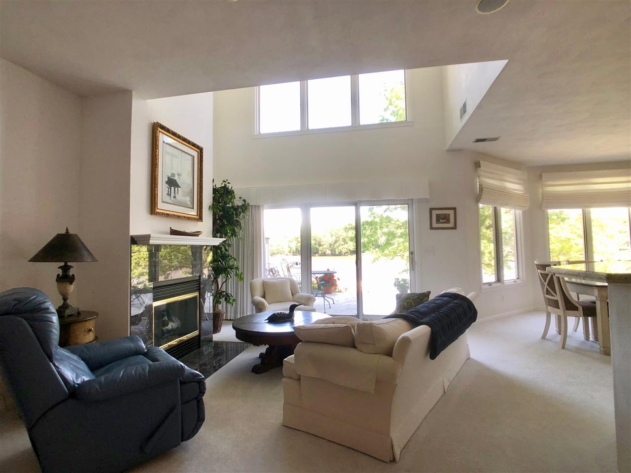 7524 North River Road Byron, IL 61010 - Photo 6 of 21 a living room with furniture and a large window