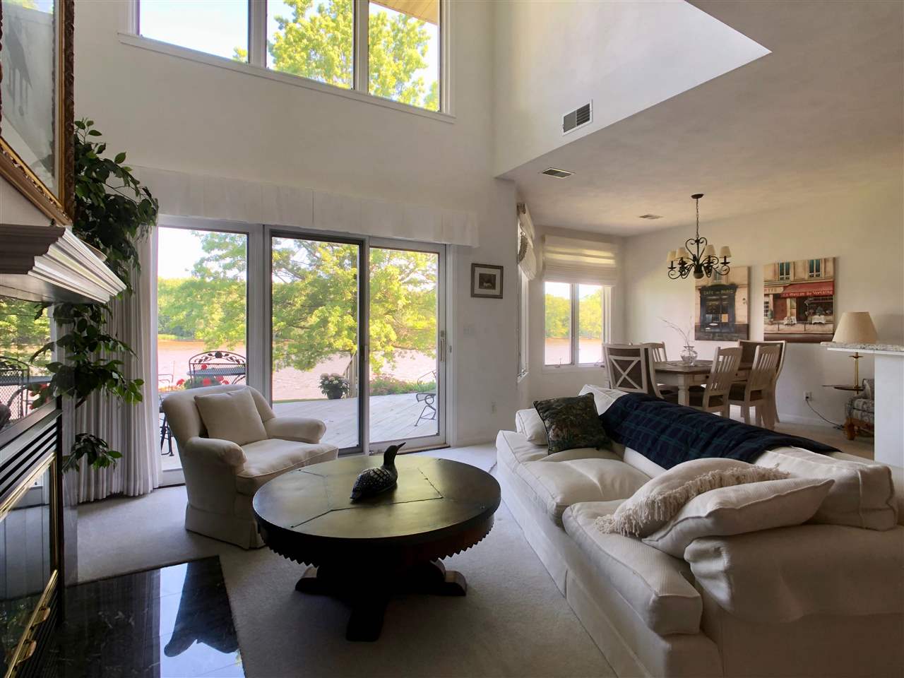 7524 North River Road Byron, IL 61010 - Photo 7 of 21 a living room with furniture and a large window