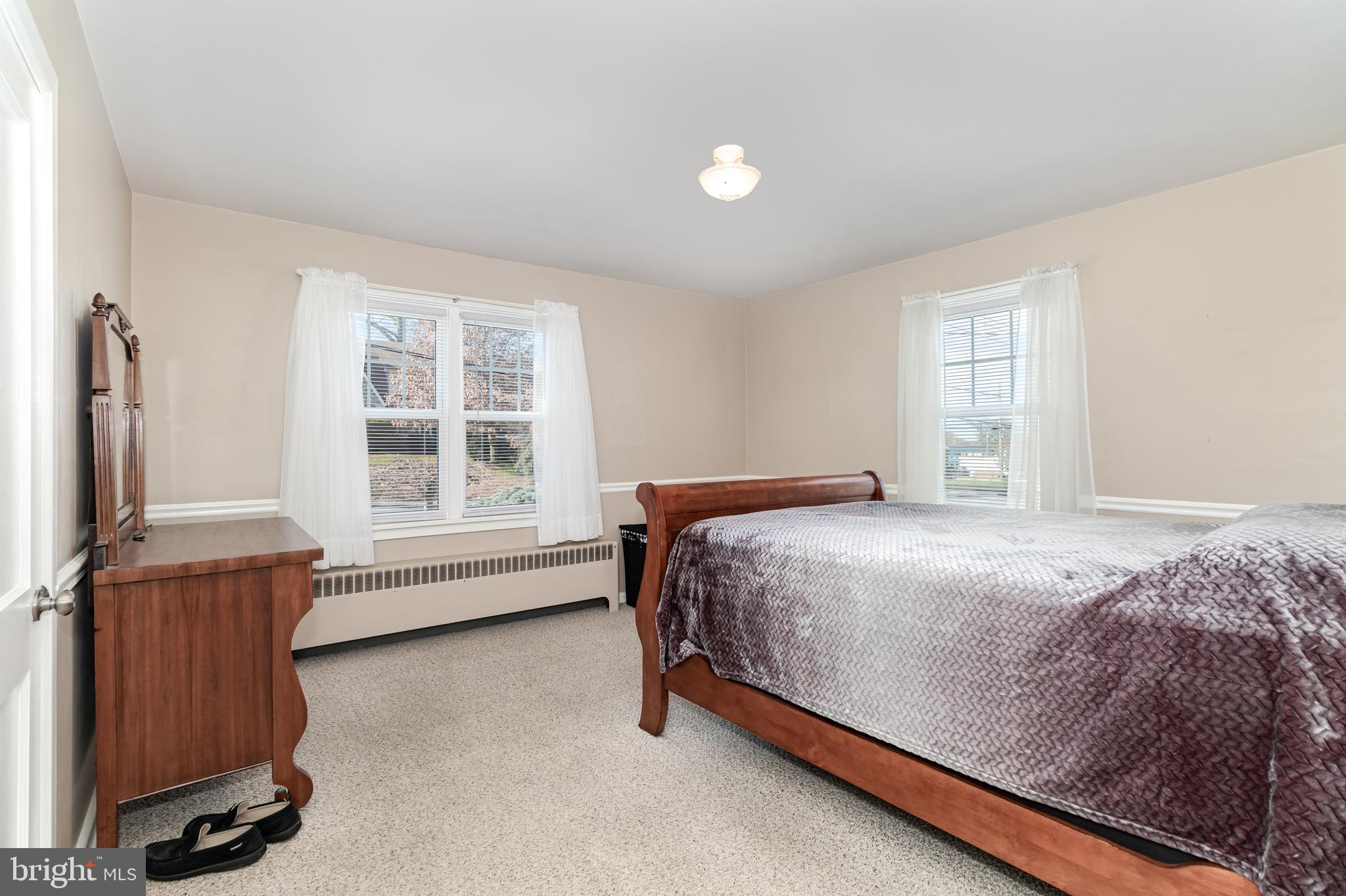 202 North Decatur Street Strasburg, PA 17579 - Photo 10 of 30 a bedroom with a bed and a window