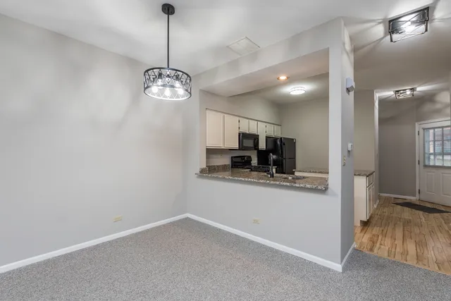 a view of living room with granite countertop furniture and fireplace