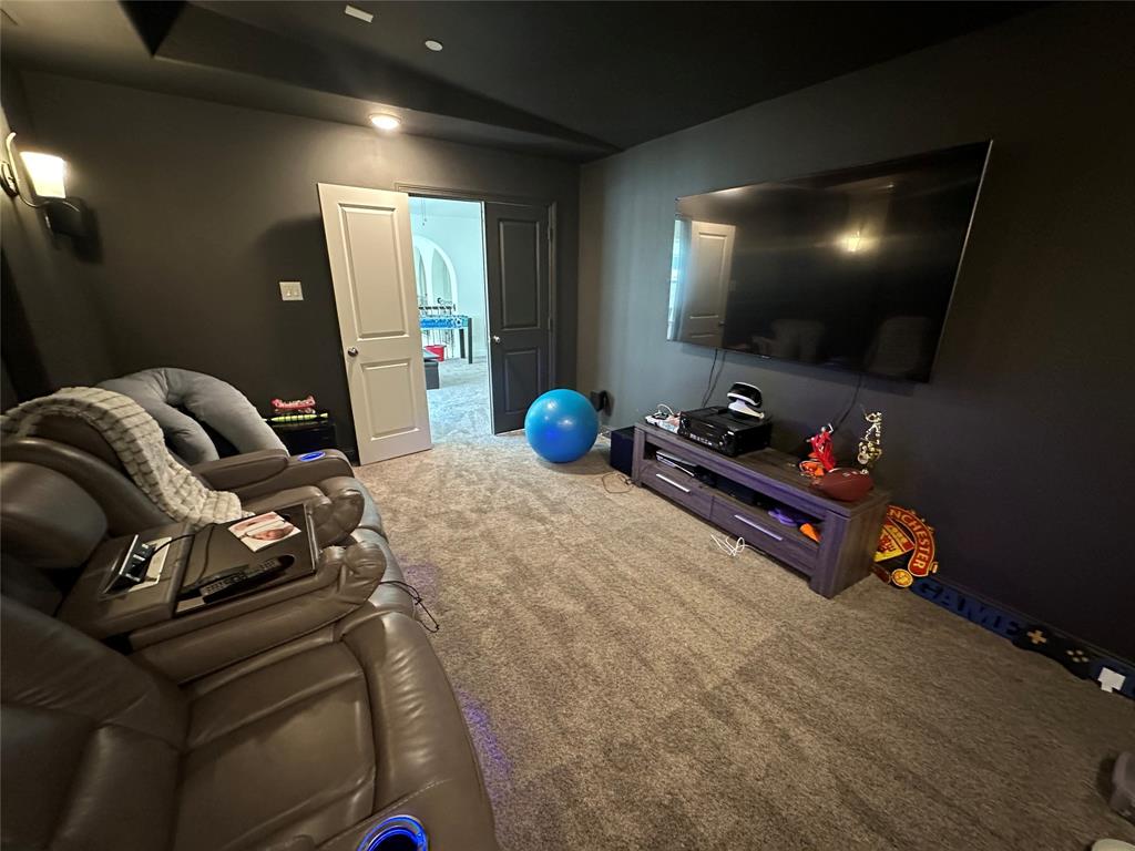 1037 Drew Lane Allen, TX 75013 - Photo 12 of 18 a room with furniture and a flat screen tv