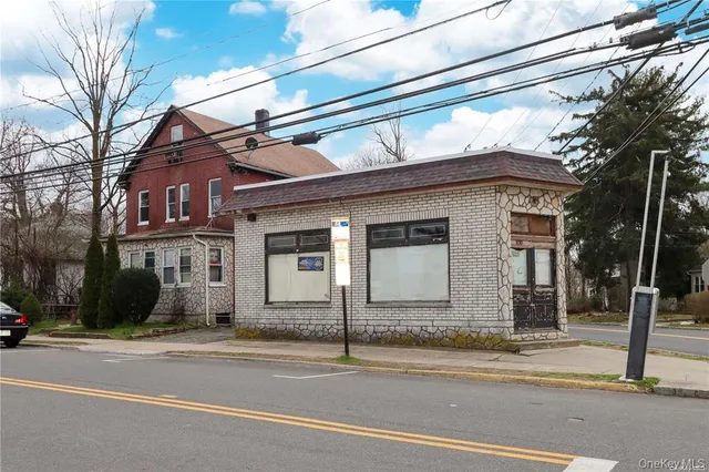 a view of a house on a street