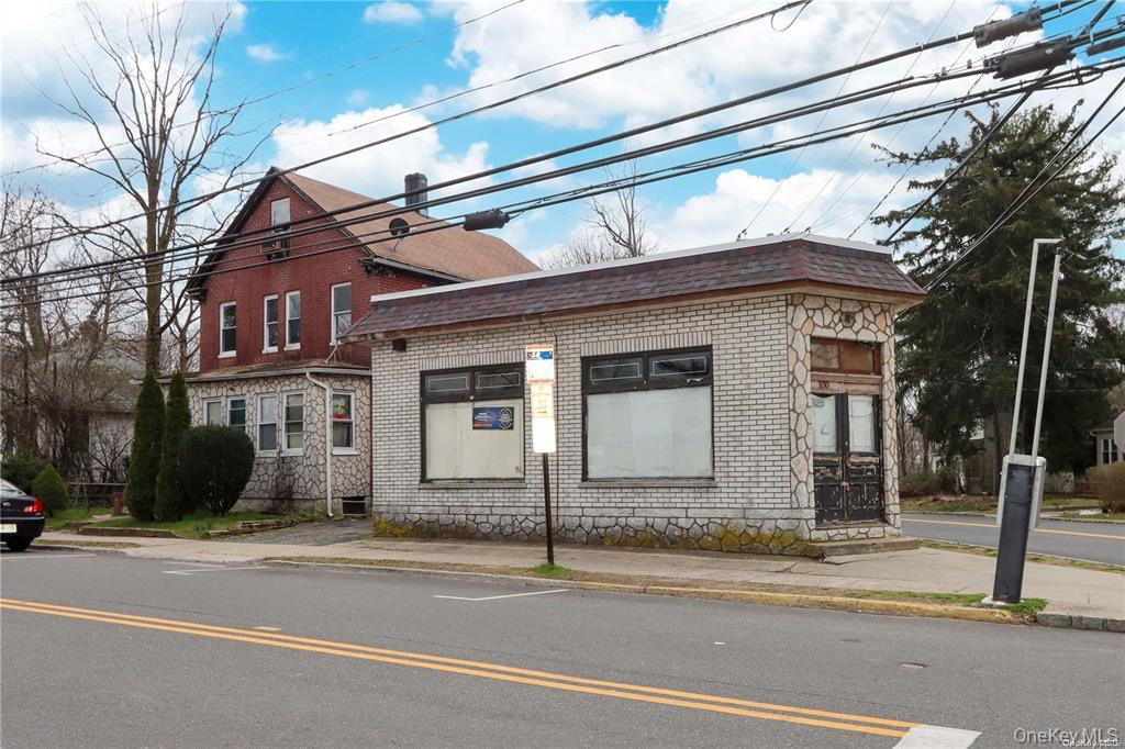 a view of a house on a street