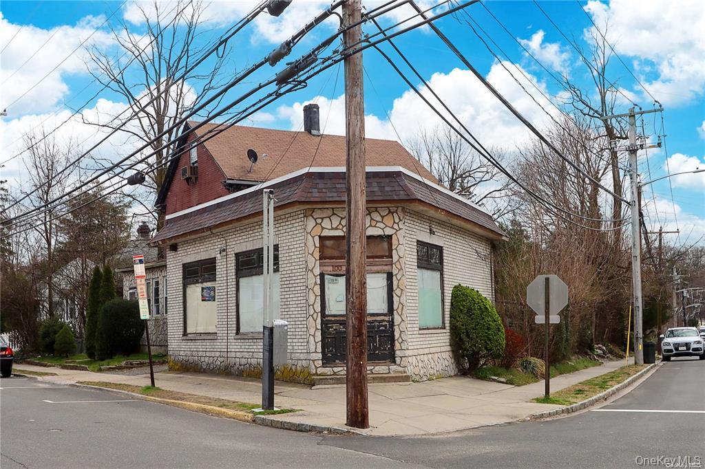 100 Steamboat Road Great Neck, NY 11024 - Photo 2 of 8 a view of a brick house with many windows