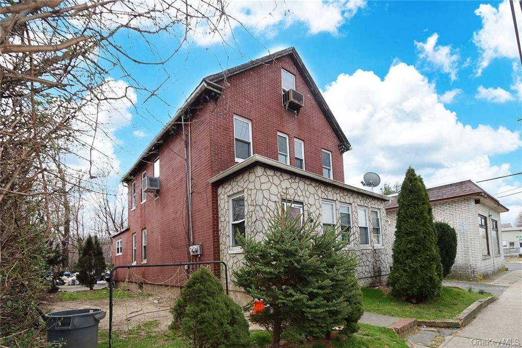 100 Steamboat Road Great Neck, NY 11024 - Photo 6 of 8 a view of a house with a yard