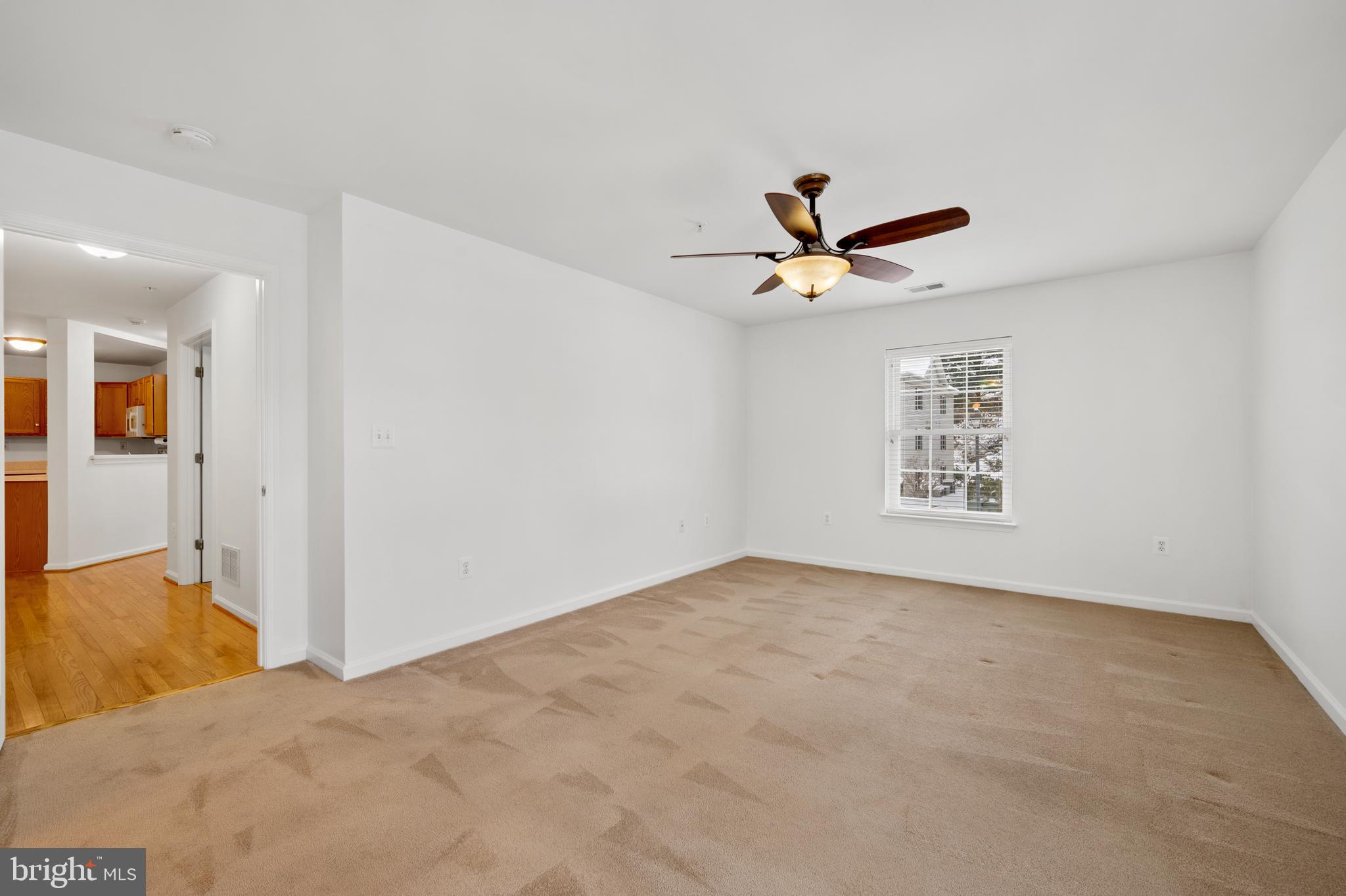 6508 Ridenour Way East, Unit 2A Sykesville, MD 21784 - Photo 13 of 20 an empty room with closet and ceiling fan
