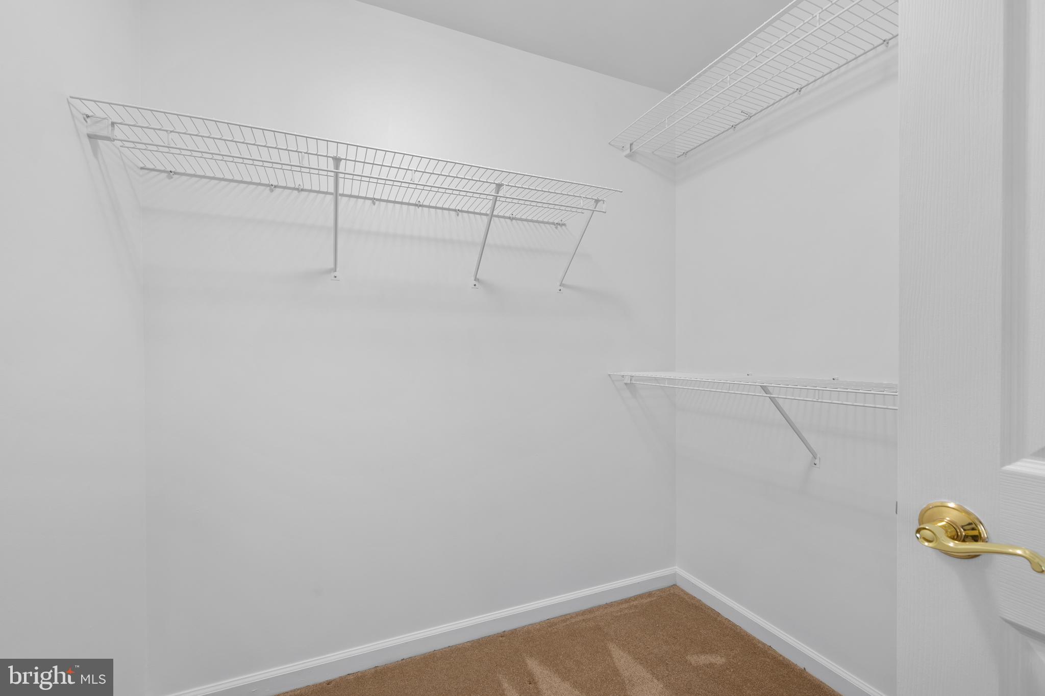 6508 Ridenour Way East, Unit 2A Sykesville, MD 21784 - Photo 15 of 20 a view of a room with racks on the wall