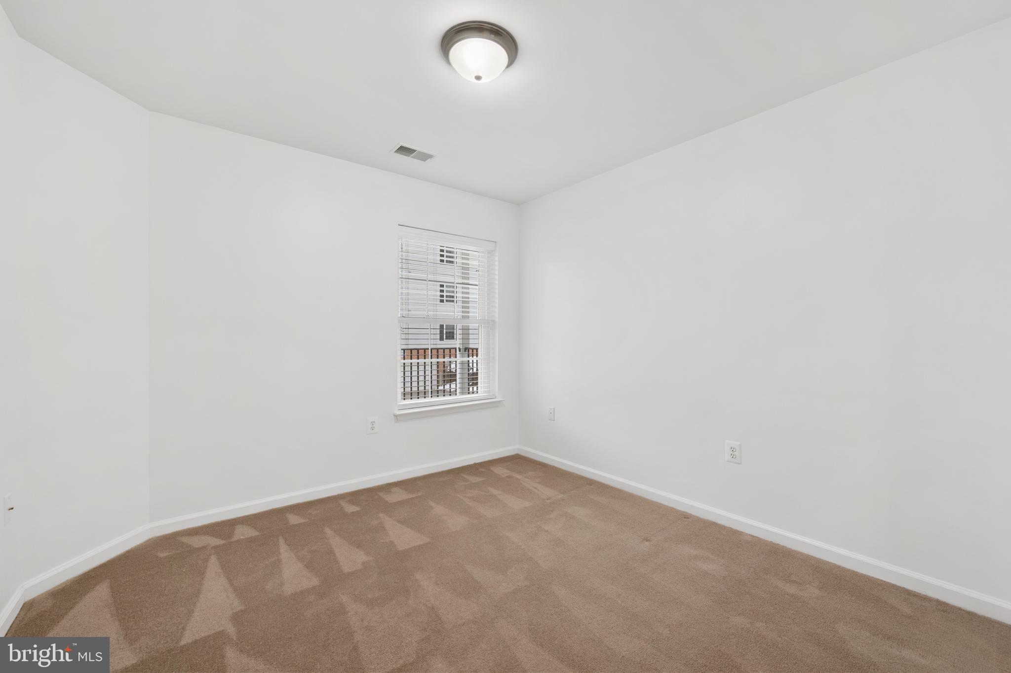 6508 Ridenour Way East, Unit 2A Sykesville, MD 21784 - Photo 16 of 20 an empty room with a window