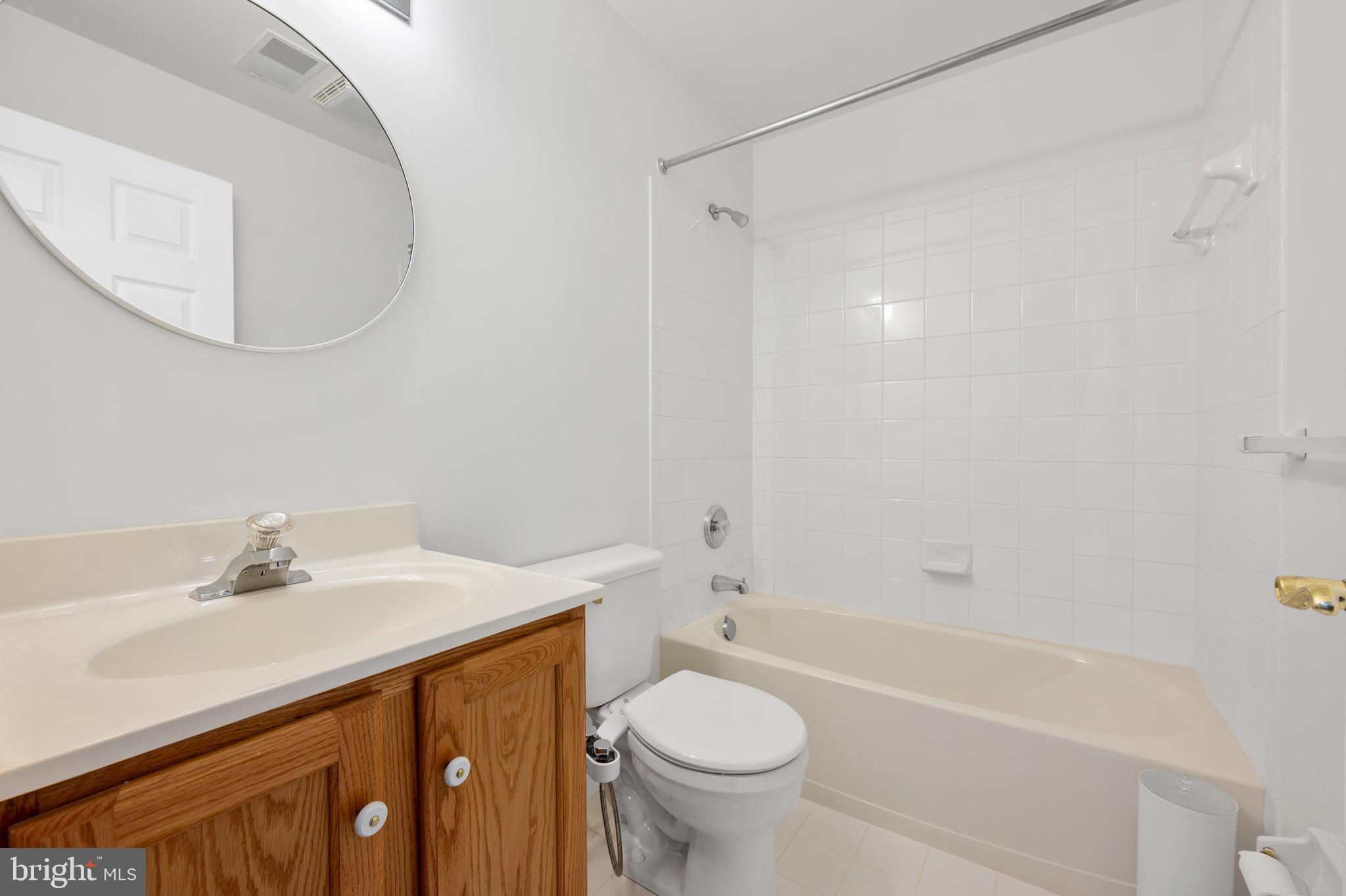 6508 Ridenour Way East, Unit 2A Sykesville, MD 21784 - Photo 17 of 20 a bathroom with a sink a toilet and a bathtub
