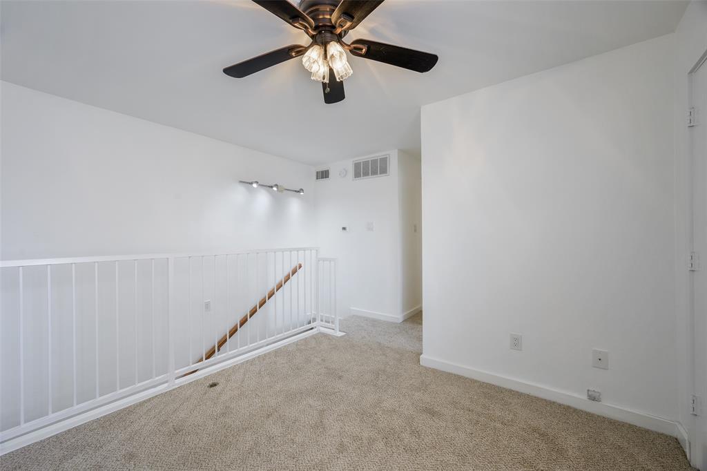 4777 Cedar Springs Road, Unit 7P Dallas, TX 75219 - Photo 8 of 21 an empty room with windows and fan