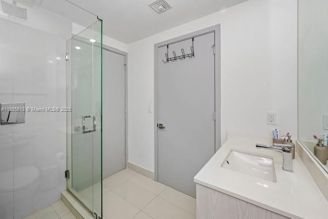 55 Southwest 9th Street, Unit 3506 Miami, FL 33130 - Photo 16 of 17 a bathroom with a sink a shower and a mirror