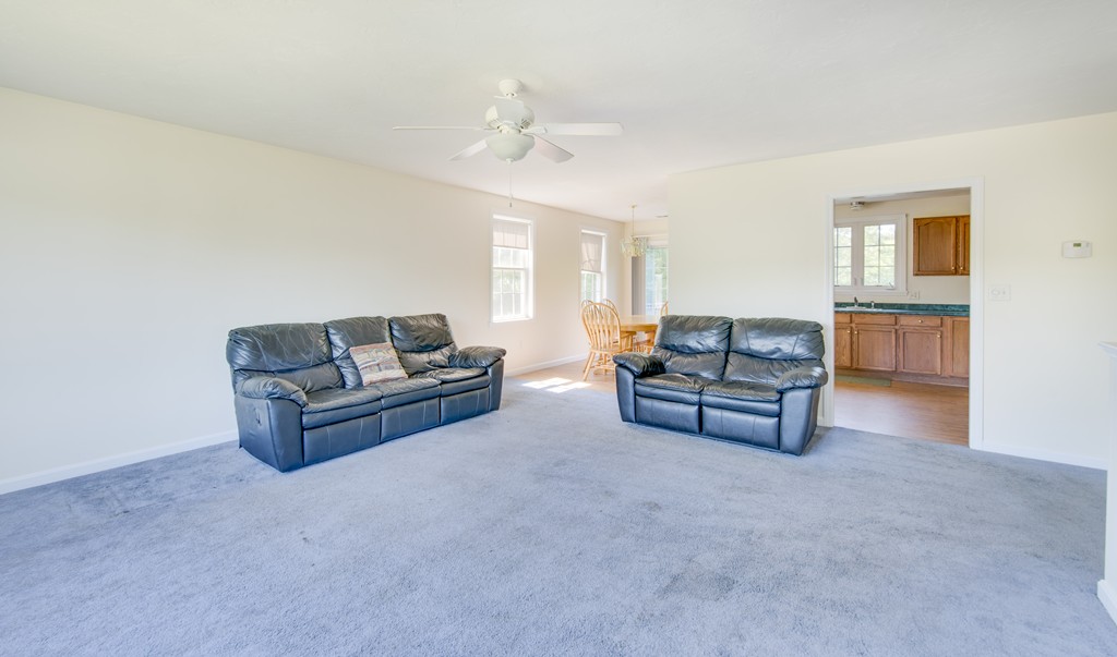 12 Hamilton Way Holbrook, MA 02343 - Photo 12 of 13 a living room with furniture and a chandelier
