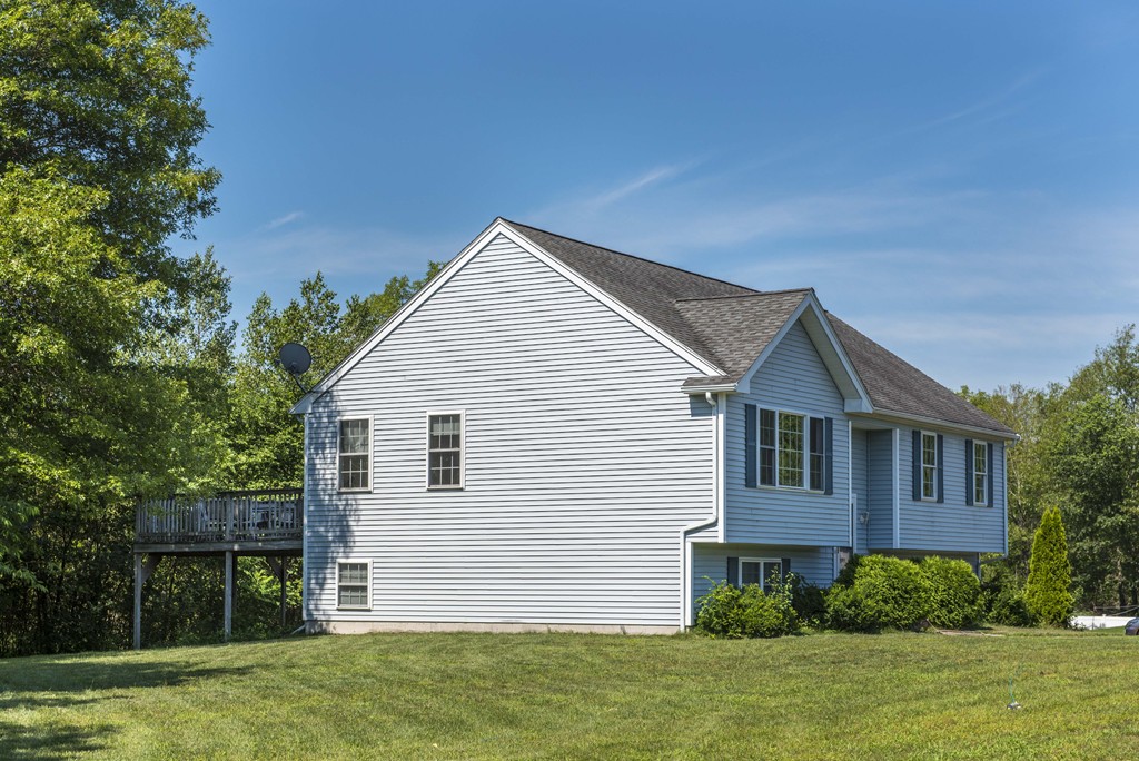 12 Hamilton Way Holbrook, MA 02343 - Photo 2 of 13 a front view of a house with a yard