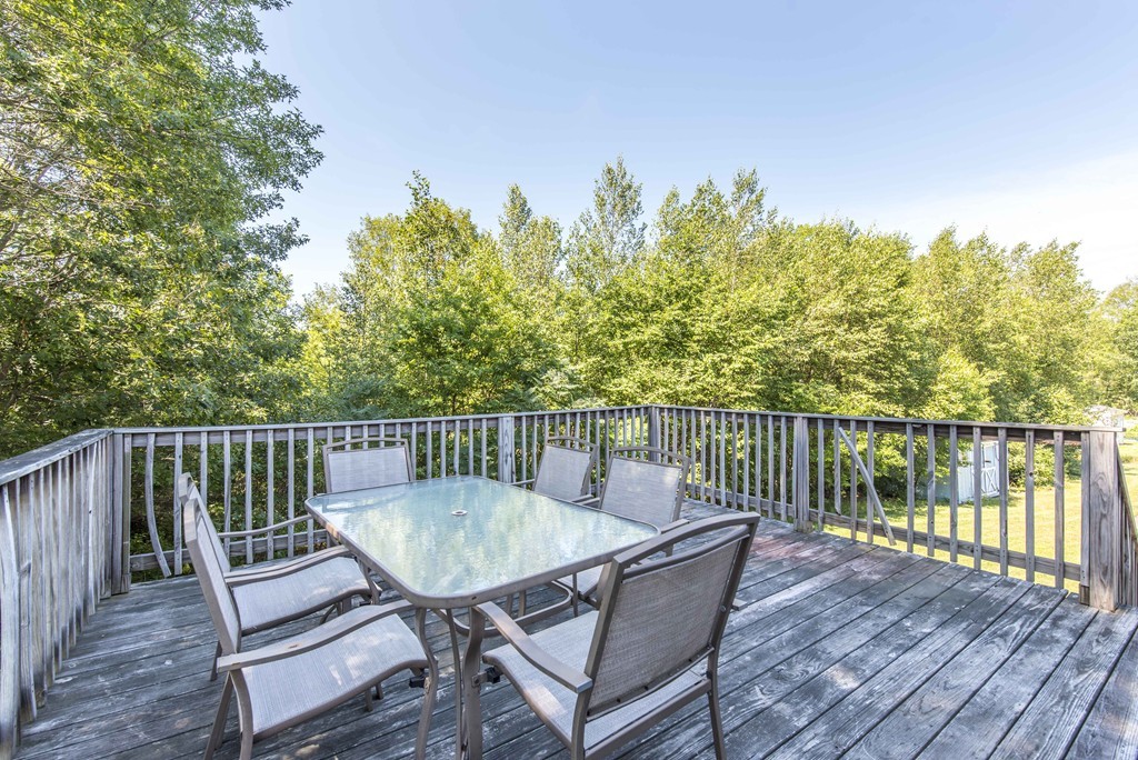 12 Hamilton Way Holbrook, MA 02343 - Photo 4 of 13 a view of a deck with two chairs and a table