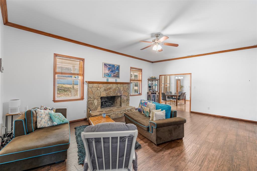 4502 Dexham Road Rowlett, TX 75088 - Photo 11 of 39 a living room with furniture and a fireplace