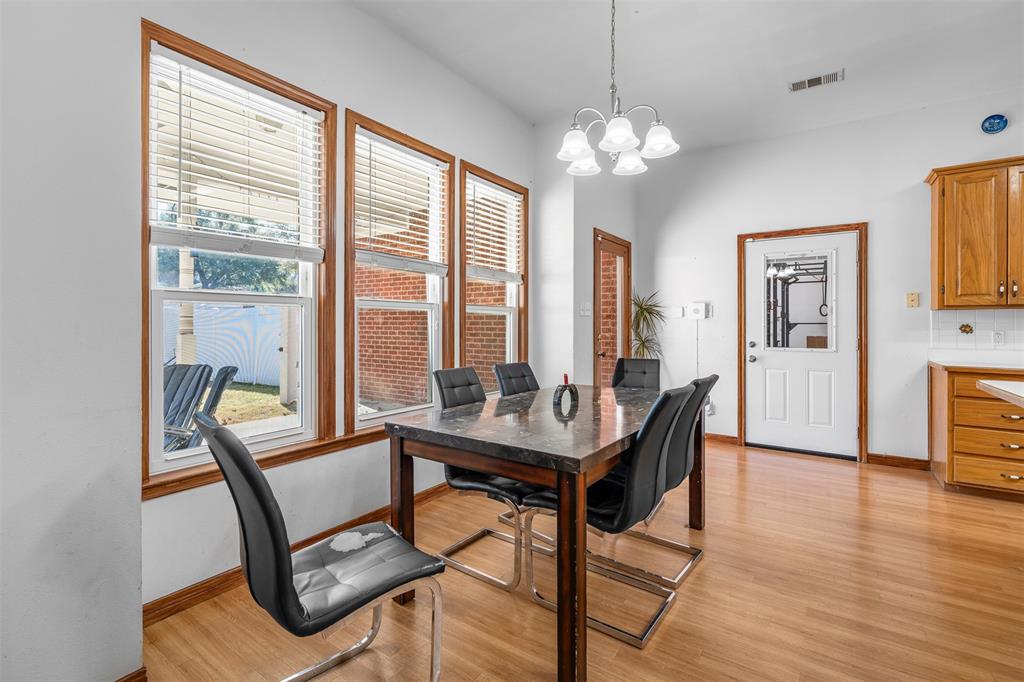 4502 Dexham Road Rowlett, TX 75088 - Photo 17 of 39 a view of a livingroom with furniture window and wooden floor