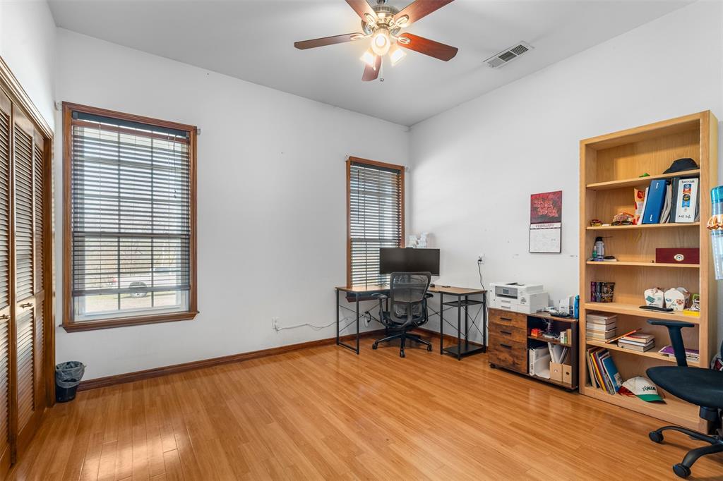 4502 Dexham Road Rowlett, TX 75088 - Photo 18 of 39 a view of a workspace with furniture and a window