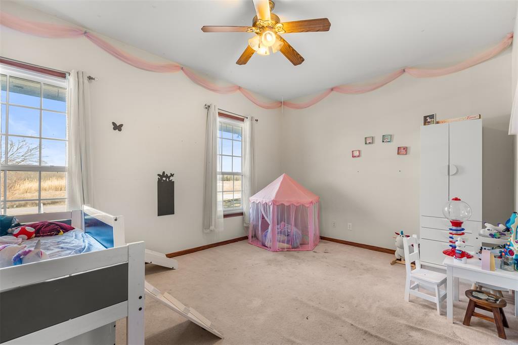 4502 Dexham Road Rowlett, TX 75088 - Photo 24 of 39 a living room with furniture and window