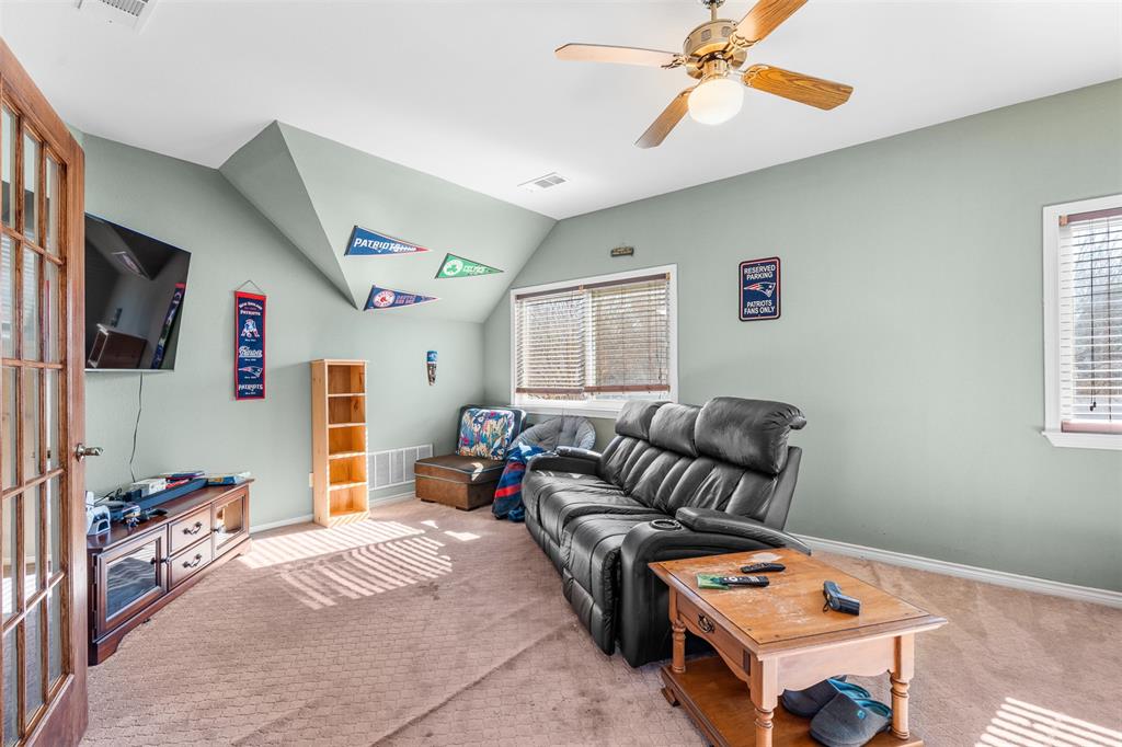 4502 Dexham Road Rowlett, TX 75088 - Photo 26 of 39 a bedroom with furniture and a window