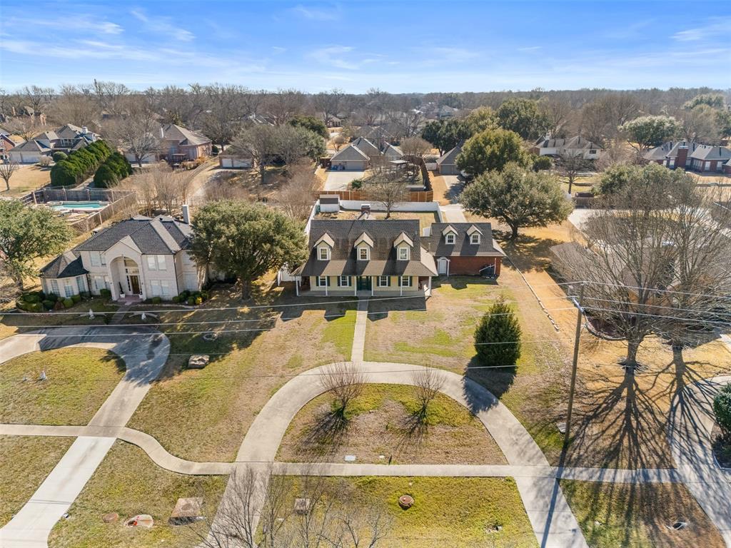 4502 Dexham Road Rowlett, TX 75088 - Photo 36 of 39 an aerial view of a house with swimming pool and mountains