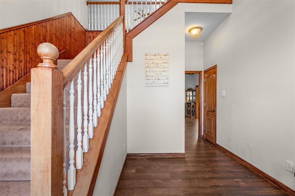 4502 Dexham Road Rowlett, TX 75088 - Photo 6 of 39 a view of entryway and hall with wooden floor