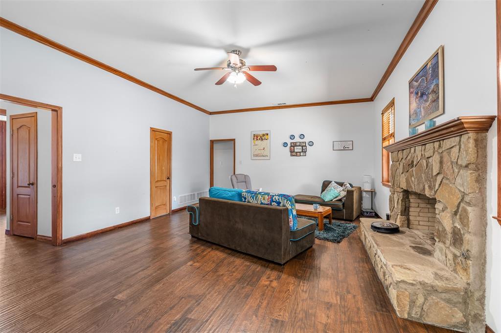 4502 Dexham Road Rowlett, TX 75088 - Photo 9 of 39 a living room with furniture and a flat screen tv