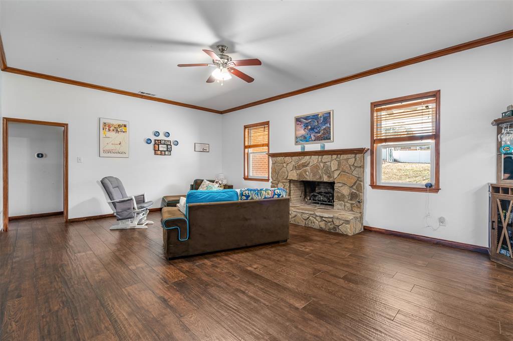 4502 Dexham Road Rowlett, TX 75088 - Photo 10 of 39 a living room with furniture and a fireplace