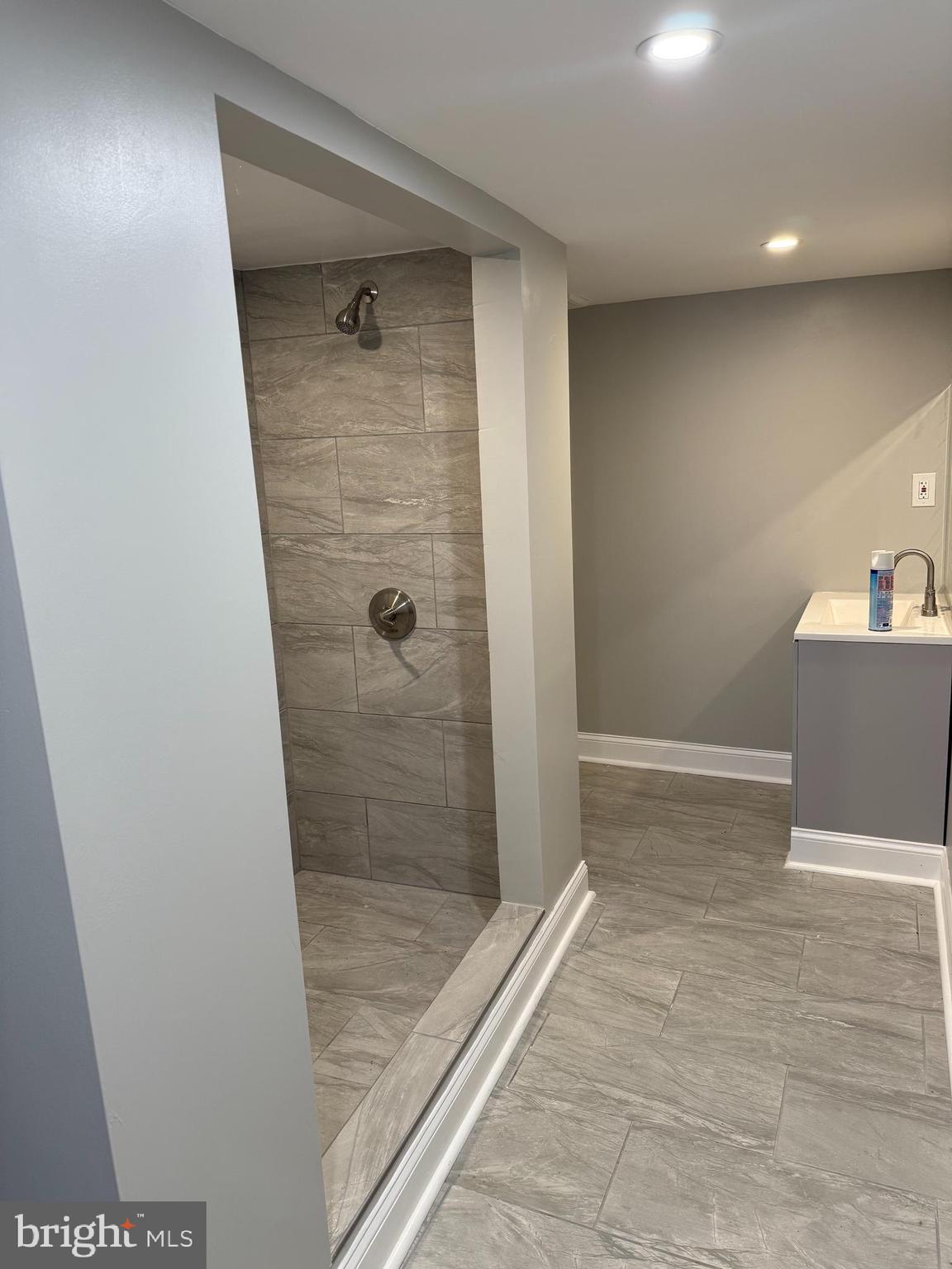 2921 Baker Street Baltimore, MD 21216 - Photo 5 of 7 a bathroom with a shower and toilet