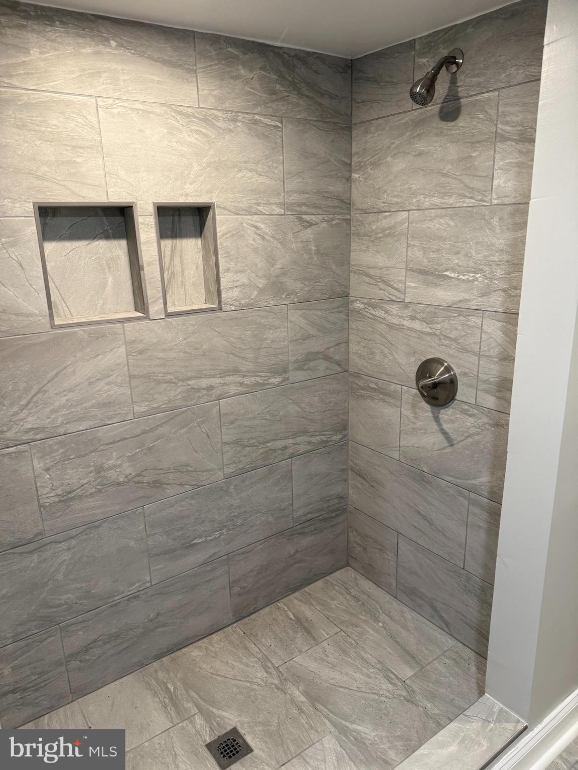 2921 Baker Street Baltimore, MD 21216 - Photo 6 of 7 a bathroom with a shower