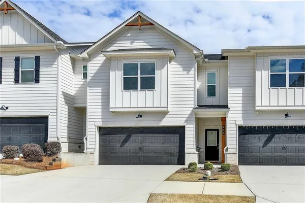 a front view of a house with yard