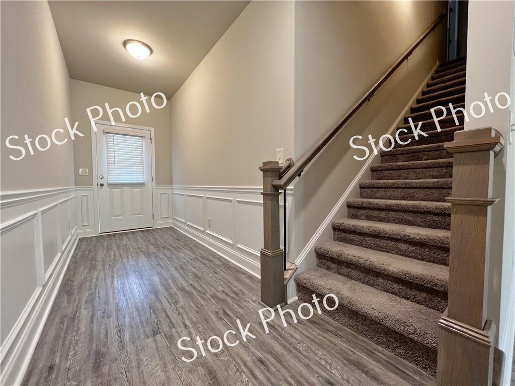 217 Rockfern Terrace Lilburn, GA 30047 - Photo 2 of 16 a view of entryway and hall with wooden floor