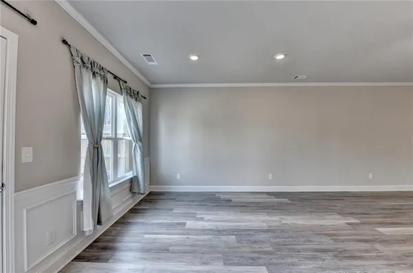 a kitchen with stainless steel appliances granite countertop a stove top oven a refrigerator a sink and a oven