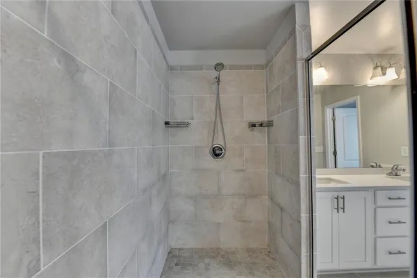 a view of a hallway with wooden shelves