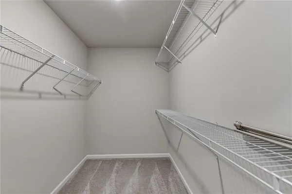 a view of an empty room and a window